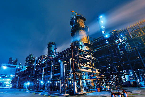 Oil Refinery, Chemical & Petroleum plant abstract at night.